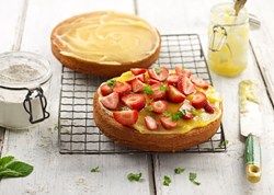 Lemon Curd used as a cake filling with fresh strawberries.